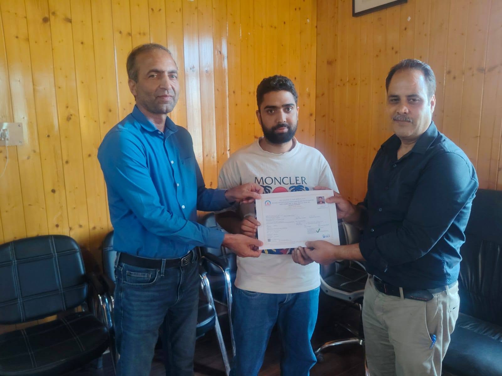 The topper of the Cloud Computing Assistant course was awarded a certificate by the Director of NIELIT Srinagar during a special ceremony held at Government ITI Pattan. The event recognised the student's outstanding academic performance.